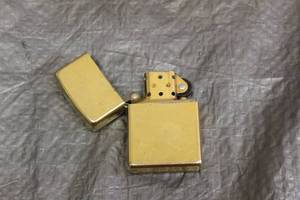lot 138 image: VINTAGE GOLD COLORED ZIPPO LIGHTER