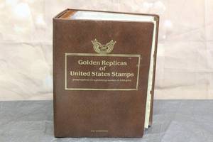 lot 66 image: GOLDEN REPLICASE OF UNITED STATES STAMPS PROOF REPLICAS ON A GLEAMING SURFACE OF 22KT GOLD WITH STORAGE&nbsp BOOK  SEE PICS&nbsp