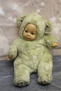 lot 126 image: VINTAGE SIMBA BABY DOLL STHK 67 SLEEPING EYES IN BEAR SUIT&nbsp