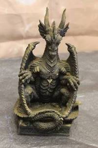 lot 154 image: BLACK HORNED SITTING DRAGON SCULPTURE&nbsp