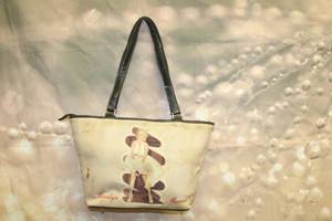 lot 241 image: TUTTI BY PAVIO MARILYN MONROE HANDBAG , 15L X 9H&nbsp