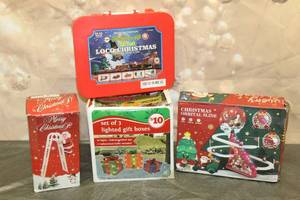 lot 242 image: CHRISTMAS&nbsp LOT - LIGHTED GIFT BOXES,ORBITAL TRACK SLIDE, MUSICAL SANTA CLAUS LADDER FIGURINE, 20PC MUSICAL LOCO CHRISTMAS TRAIN SET No. 209  SEE PICS&nbsp