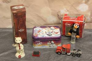 lot 276 image: COCA COLA LOT - 1996&nbsp SOUTHWEST AIRLINES 25 YEAR CELEBRATING ANNIVERSARY BOTTLE ,UNO CARD GAME SPECIAL EDITION&nbsp WITH TIN CAN ,PENGUIN PLUSH&nbsp ORNAMENT, POLAR BEAR BOBBLEHEAD, HEAVY HAULER SEMI TRUCK&nbsp