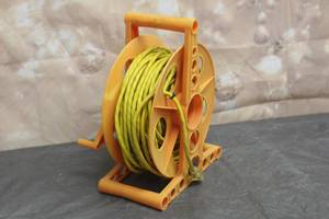 lot 108 image: 100 EXTENTION CORD WITH REEL