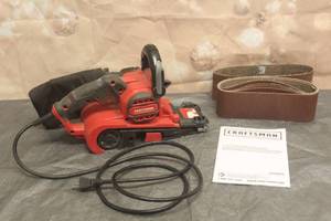 lot 24 image: CRAFTSMAN BELT SANDER CMEW213 WITH SAND PAPER ROLLS AND MANUAL