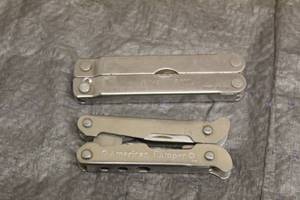 lot 151 image: 2 MULTI-TOOLS  LEATHERMAN AND AMERICAN CAMPER
