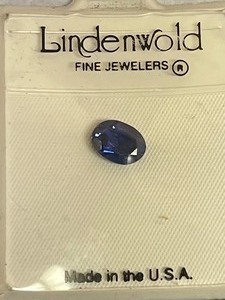 lot 23 image: LINDENWOLD 1.25 CARAT OVAL CUT SYNTHETIC ROYAL BLUE SAPPHIRE WITH COA