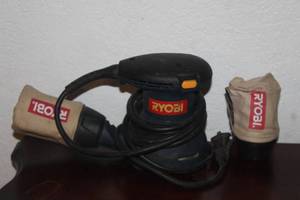 lot 186 image: RYOBI RS28OVS CORDED ELECTRIC ORBITAL PALM SANDER WITH EXTRA FILTER