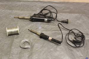 lot 106 image: TOTAL OF 2 SOLDERING IRONS WITH SOLDERING WIRE