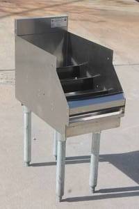 lot 22 image: KROWNE 18-12RD STAINLESS STEEL UNDERBAR BOTTLE HOLDER