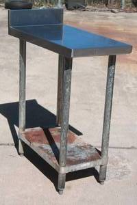 lot 28 image: STAINLESS STEEL TWO TIER TABLE WITH UNDERSHELF AND BACKSPLASH ,30L X 15 X 38H&nbsp