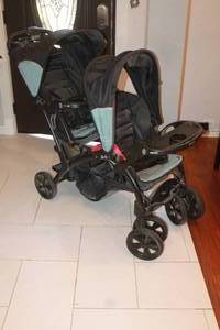 lot 71 image: BABYTREND SIT N STAND DOUBLE BABY STROLLER