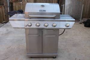 lot 84 image: NEXGRILL STAINLESS STEEL 4-BURNER WITH OPTIONAL SIDE BURNER FOR PREPARING SAUCES AND SIDE DISHES PROPANE GAS GRILL  SEE PIC  PROPANE TANK INCLUDED