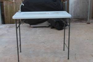lot 86 image: FOLDING FILLET MULTI FUNCTIONAL OUTDOOR  TABLE WITH SINK FAUCET COMBO  SEE PICS