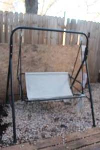 lot 90 image: BLACK METAL PATIO SWING  NEED REPLACEMENT SWING SEAT COVER  SEE PICS