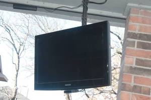 lot 92 image: SAMSUNG TV WITH APPLE TV STREAMING DEVICE    WILL BE DISASSEMBLED  BEFORE PICK UP
