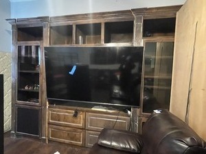 lot 257 image: VERY LARGE SOLID  WOOD ENTERTAINMENT CENTER 6 PIECES  BIDDER MUST DISASSEMBLE BEFORE MOVING BRING DRILL AND BITS  PLEASE BRING HELP  TV NOT INCLUDEDPLEASE NOTE ITEM IS UPSTAIRS