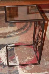 lot 48 image: METAL  GLASS TOP C-SHAPED WITH LEAVES  VINE  END SIDE TABLE