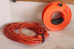 lot 159 image: ORANGE 100FT EXTENSION CORD WITH CORD WHEEL
