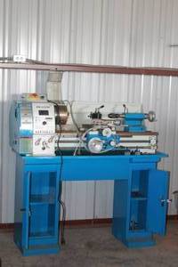 lot 98 image: PM-1127VF-LB  PRECISION METAL LATHE WITH STAND &amp ACCESSORY ATTACHMENTS  2 PIECES LATHE AND STAND BRING HELP TO REMOVE. SEE PICS