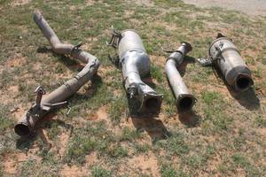 lot 232 image: TOTAL OF 4 ASSORTED VEHICLE EXHAUST PIPES ,CATALYTIC CONVERTER, DOWNPIPE ,  UNKNOWN CONDITION  SEE PICS&nbsp