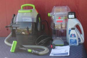 lot 110 image: BISSELL SPOT CLEAN PRO LITTLE GREEN PROPORTABLE CARPET CLEANER  2505 WITH USED CARPET CLEAN & PROTECT SOLUTION S