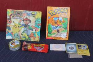 lot 137 image: POKEMON COLLECTIBLE LOT ,TCG TREECKO,ISLAND OF THE GIANT POKEMON BOOK ,LOT OF TRADING CARDS (16), #54 PSYDUCK PUNCH LOLLIPOP, BUBBLE GUM ( NOT FOR CONSUMPTION ),