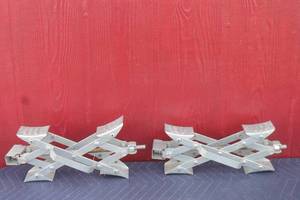 lot 144 image: TOTAL OF 2  ULTRA FAB SUPER GRIP STAINLESS STEEL CHOCKS