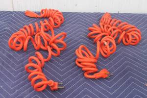 lot 291 image: TOTAL OF 2 COILED ORANGE ELECTRICAL CABLES