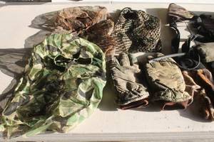 lot 174 image: MISC LOT - GLOVES , HEADNETS , STORAGE BAG AND MORE  SEE PICS