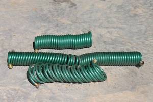 lot 19 image: TOTAL OF 3 COILED&nbsp RECOIL GARDEN HOSES&nbsp