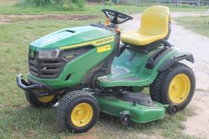 lot 153 image: JOHN DEERE S180&nbsp &nbsp54 24-HP-V -TWIN GAS RIDING LAWN MOWER WITH EXTRA SPARE FRONT TIRE  SEE ATTACHED VIDEO&nbsp