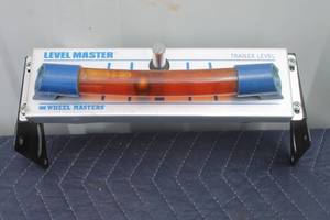 lot 115 image: LEVEL MASTER WHEEL MASTERS TRAILER LEVEL WITH MOUNTING BRACKET&nbsp