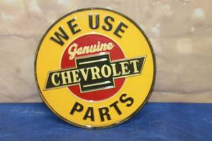 lot 168 image: GENERAL MOTORS WE USE GENUINE CHEVROLET PARTS&nbsp METAL WALL SIGN ,12 DIAM&nbsp
