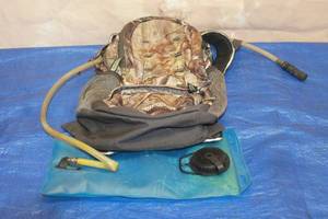 lot 185 image: REMINGTON HYDRATION HUNTINGCAMPING BACKPACK  STRAPS NEED TO BE RESEWED  SEE PICS&nbsp