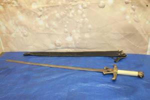 lot 283 image: VINTAGE DUAL EAGLE WITH HERALDIC - STYLE SHIELD 4FT. 38 SWORD MADE IN PAKISTAN WITH LEATHER SHEATH  SEE PICS&nbsp