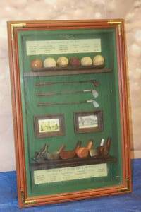 lot 294 image: WOOD FRAMED SHADOW BOX&nbsp DISPLAY SHOWCASING THE HISTORICAL DEVELOPMENT OF GOLF BALLS &amp GOLF CLUBS WALL DECOR , 21 X 13  SEE PICS&nbsp