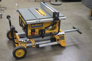 lot 15 image: DEWALT&nbsp 10 IN.COMPACT JOB SITE ROLLING TABLE SAW STAND DW7440RS  TESTED &amp RUNS&nbsp