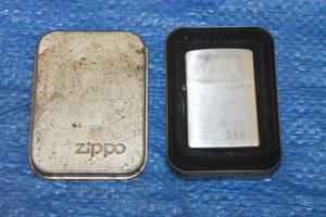 lot 70 image: ZIPPO 04 BRADFORD LIGHTER IN TIN ZIPPO CASE&nbsp