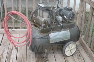 lot 59 image: SEARS BEST AIR COMPRESSOR WITH RED AIR HOSE&nbsp