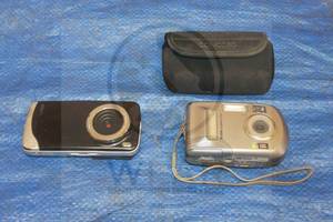 lot 104 image: TOTAL OF 2 CAMERAS , KODAK EASY SHARE C310 &amp SLICK VIDEO CAMERA AND CONCORD CAMERA STORAGE&nbsp