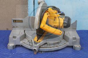 lot 57 image: DEWALT DW705 COMPOUND MITER SAW WITH BLADE  HANDLE NEED REPAIR  SEE PICS&nbsp