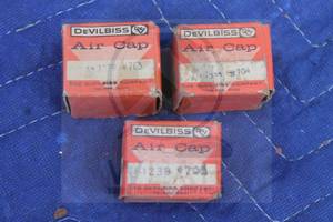 lot 210 image: TOTAL OF 3 DEVILBISS SPRAY GUN NOZZLE AIR CAPS IN ORIGINAL BOX, 765, 704, 705&nbsp