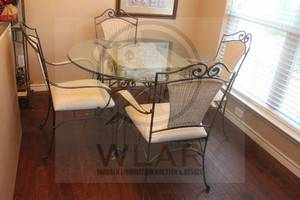 lot 61 image: TOTAL OF 5PC&nbsp WROUGHT IRON&nbsp WHITE WICKER ROUND GLASS TOP&nbsp DINING TABLE WITH 4- WROUGHT IRON&nbsp WHITE WICKER DINING CHAIRS , 4FT DIAM X 29H  SEE PICS&nbsp