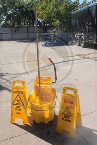 lot 122 image: RUBBERMAID COMMERCIAL BUCKET MOP AND 2- RUBBERMAID WET FLOOR SIGNS  SEE PICS&nbsp