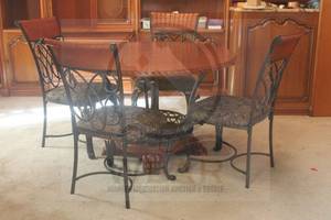 lot 11 image: ASHLEY FURNITURE ST LAURENT ROUND 47 DIAM X 31H BROWN WOOD FINISH&nbsp WROUGHT IRON CLAW FEET TABLE WITH 4 SIDE CHAIRS D445-04  BRING HELP  MATCH # 10&nbsp
