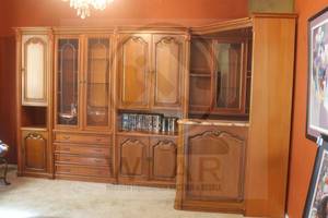lot 17 image: VERY LARGE GERMAN SHRUNK IMPORTED FROM GERMANY, ORNATE SOLID WOOD WITH MULTIPLE SECTIONS, GLASS FRONTED CABINETS FOR DISPLAY CLOSED CABINETS FOR STORAGE AND OPEN SHELVING INCLUDING MARBLE TOP HOME BAR  BRING LOTS OF HELP AND TRUCK DOLLY ,SEE PICS
