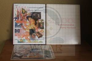 lot 49 image: THE 2000 COMMEMORATIVE STAMP YEAR BOOK WITH SEALED PACK OF STAMPS  SEE PICS&nbsp