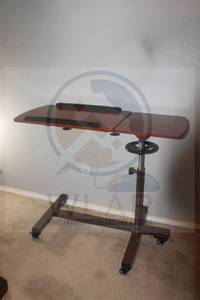 lot 74 image: WOODEN HEAVY DUTY MRDICAL OVERBED AJUSTABLE 360 SWIVEL TABLE ON WHEELS , 43 L X 18W&nbsp