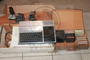 lot 148 image: 1981 VINTAGE TEXAS INSTRUMENTS HOME COMPUTER TI-994A WITH JOYSTICK &amp POWERCORD AND LOT OF SOFTWARE CARTRIDGES IN ORIGINAL BOX  SEE PICS&nbsp